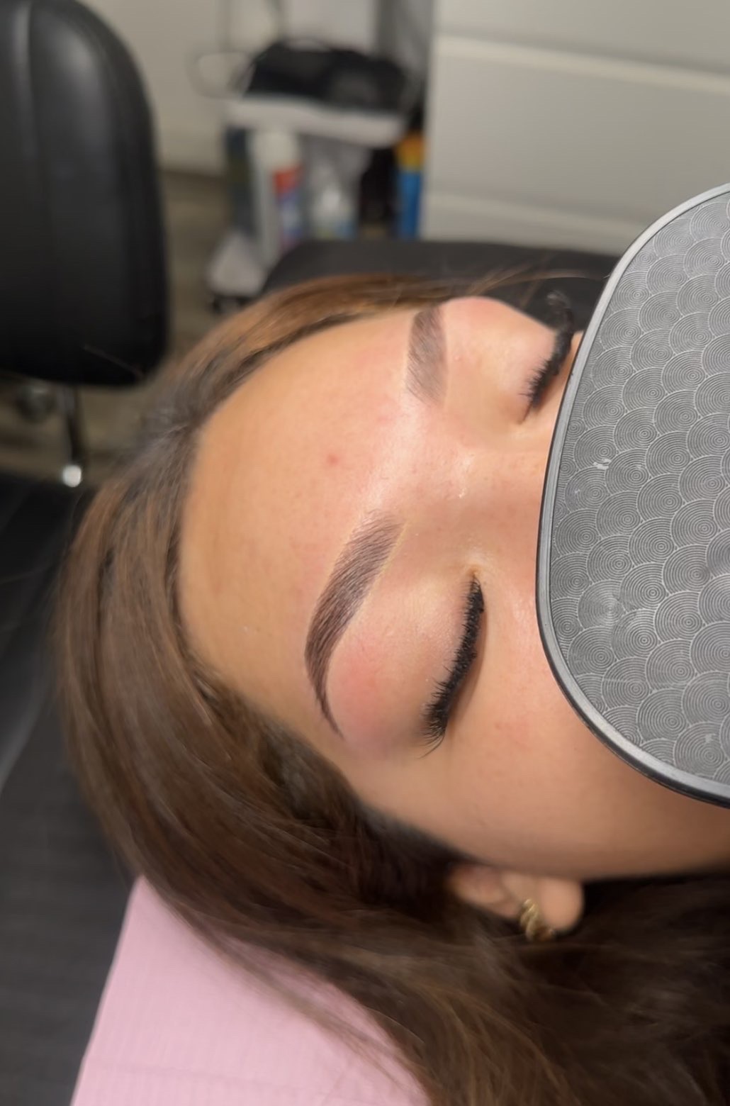 After: the same client's brows shaped into a clean, defined arch with a deeper, even color.