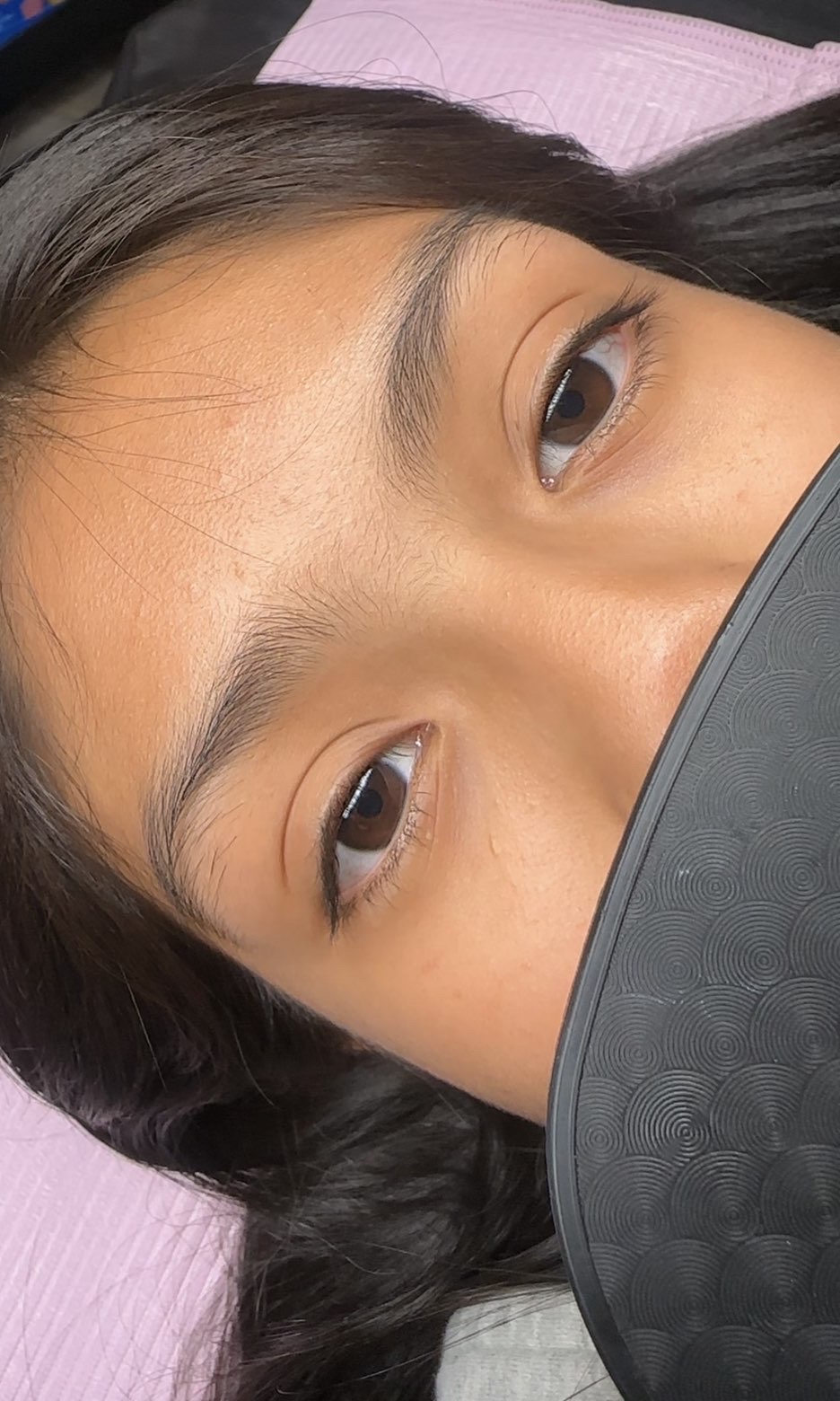Before: close-up of the client's eyes, open, with short, straight natural lashes.